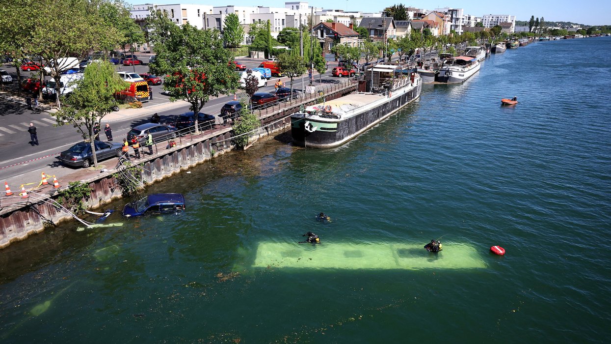 ​Both vehicles were left stranded in the river