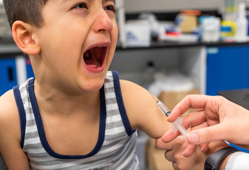 Boy getting vaccinated