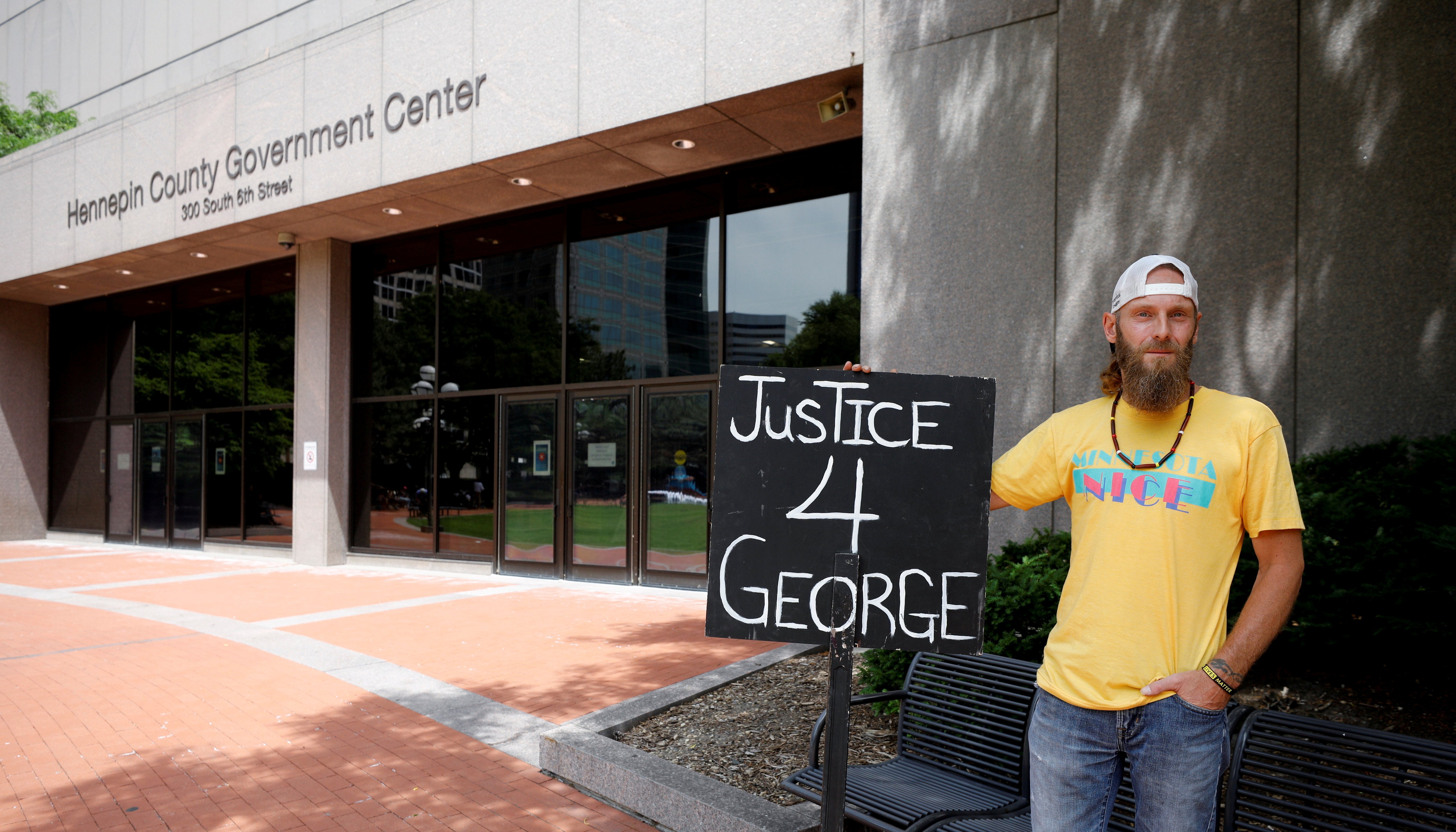 Brandon Pomerleau poses for a picture outside Hennepin County Government Center