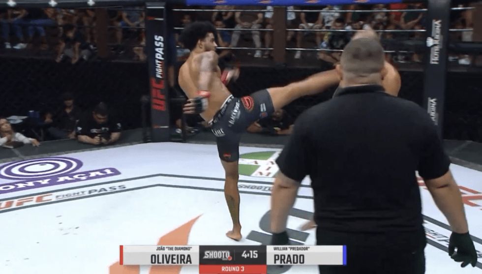 Brazilian fighter Joao Oliveira delivered a powerful head kick that appeared to knock Willian Prado out