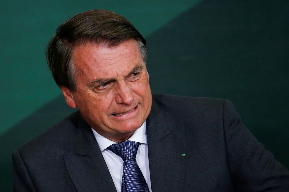 Brazil's President Jair Bolsonaro reacts during the launching ceremony of the National Green Growth Program, at the Planalto Palace in Brasilia, Brazil October 25, 2021. REUTERS/Adriano Machado