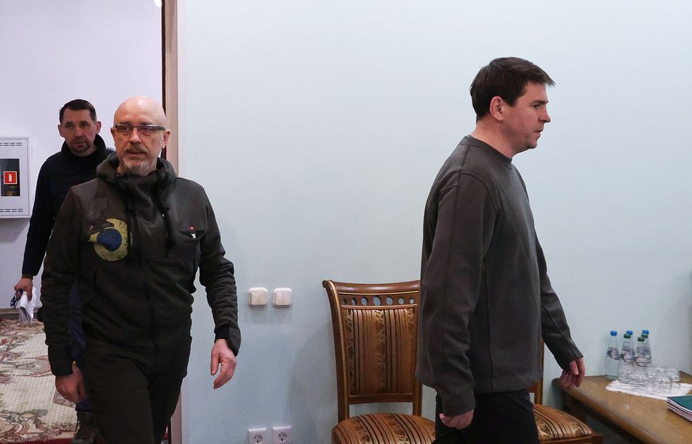 BREST REGION, BELARUS - MARCH 3, 2022: Mykhailo Podolyak, adviser to the Head of the Office of the Ukrainian President, and Ukraine's Defence Minister Oleksii Reznikov (R-L) are seen ahead of the Russian-Ukrainian talks at the Belovezhskaya Pushcha National Park. The first round of the negotiations was held in the Gomel Region, Belarus, on 28 February 2022. Early on 24 February, Russia's President Putin announced his decision to launch a special military operation after considering requests from the leaders of the Donetsk People's Republic and Lugansk People's Republic. Maxim Guchek/BelTA/TASS.No use Russia.