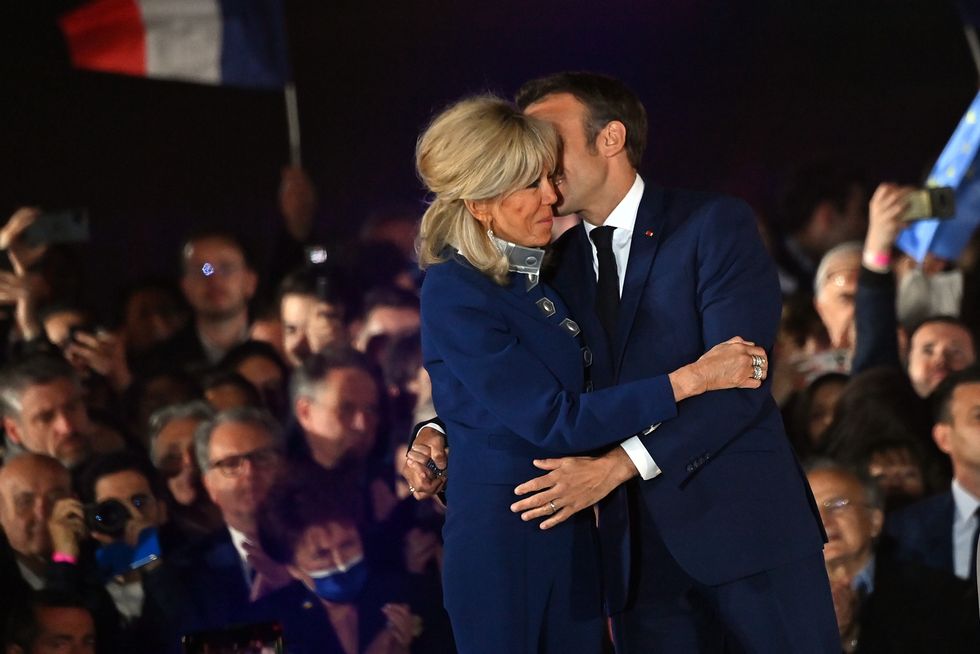 Brigette and Emmanuel Macron embracing