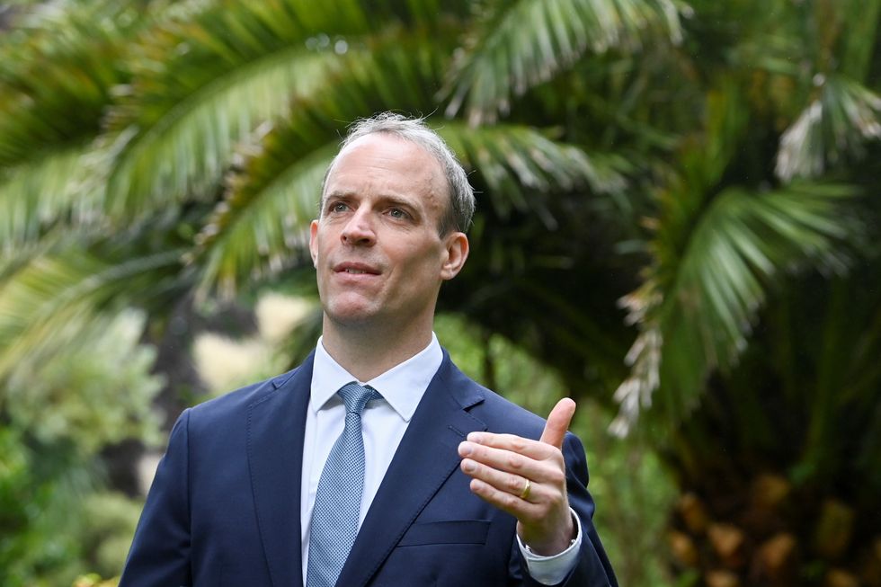 Britain's Foreign Secretary Dominic Raab gestures during an interview at the G7 summit.