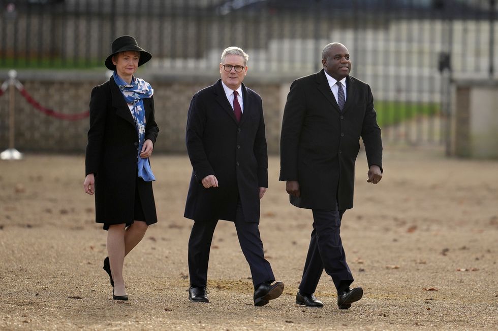 Britain's Home Secretary Yvette Cooper (L), Britain's Prime Minister Keir Starmer (C) and Britain's Foreign Secretary David Lammy (R)