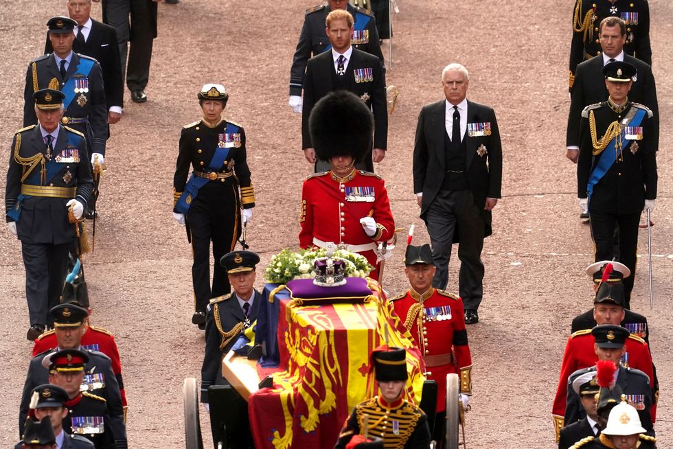 Britain's King Charles III, Anne, Princess Royal, William, Prince of Wales, Prince Andrew, Prince Edward, Prince Harry, and Peter Phillips follow the coffin of Queen Elizabeth II, draped in the Royal Standard with the Imperial State Crown placed on top, as it is carried on a horse-drawn gun carriage of the King's Troop Royal Horse Artillery, during the ceremonial procession from Buckingham Palace to Westminster Hall, London, where it will lie in state ahead of her funeral on Monday. Picture date: Wednesday September 14, 2022. Victoria Jones/Pool via REUTERS