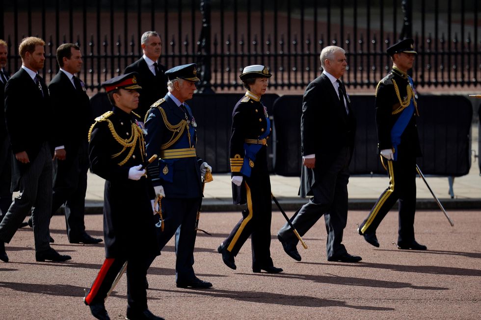 Britain's King Charles, Prince Andrew and Prince Harry march during a procession where the coffin of Britain's Queen Elizabeth is transported from Buckingham Palace to the Houses of Parliament for her lying in state, in London, Britain, September 14, 2022. REUTERS/Sarah Meyssonnier