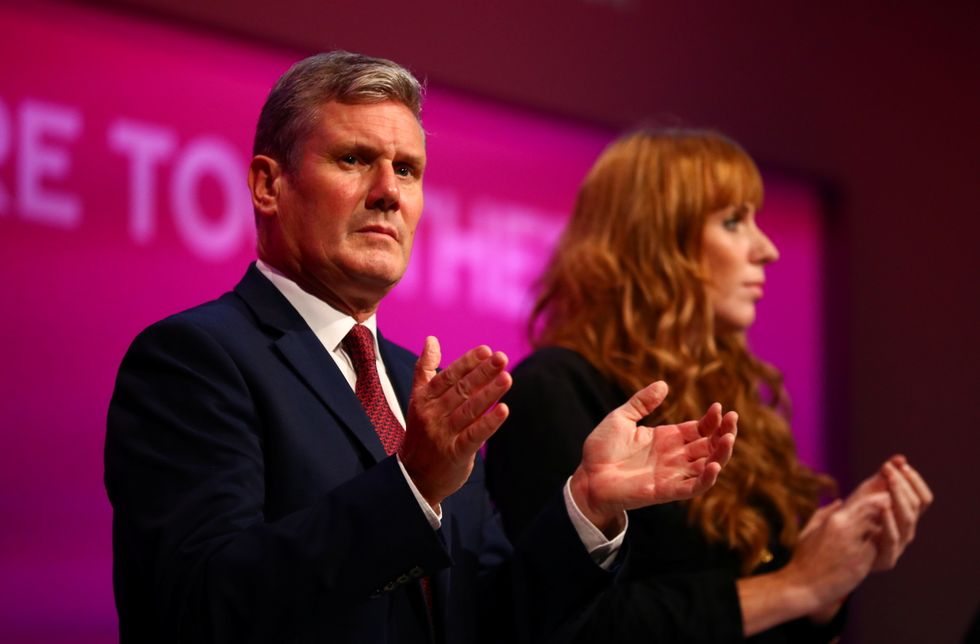 Britain's Labour Party leader Keir Starmer and party's Deputy Leader Angela Rayner clap during Britain's Labour Party annual conference, in Brighton