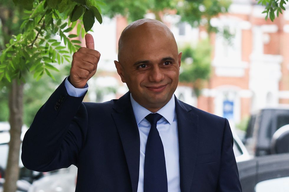 Britain's new Health Secretary Sajid Javid gestures, as he leaves his home in London