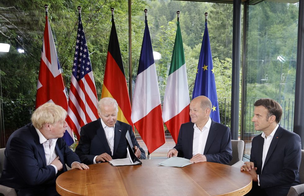 Britain's Prime Minister Boris Johnson, U.S. President Joe Biden, Germany's Chancellor Olaf Scholz and France's President Emmanuel Macron attend a meeting alongside the G7 leaders summit at Bavaria's Schloss Elmau, near Garmisch-Partenkirchen, Germany June 28, 2022. Ludovic Marin/Pool via REUTERS