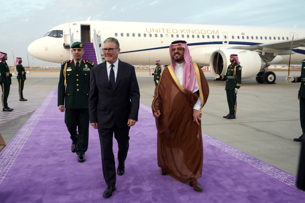 Britain's Prime Minister Keir Starmer is greeted as he arrives at the airport on April 8, 2026 in Jeddah, Saudi Arabia.