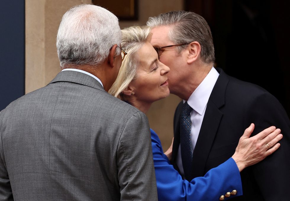 Britain's Prime Minister Keir Starmer kisses European Commission President Ursula von der Leyen\u200b