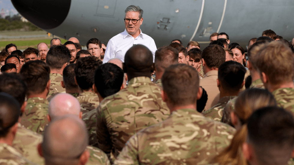 Britain's Prime Minister Keir Starmer speaks to soldiers