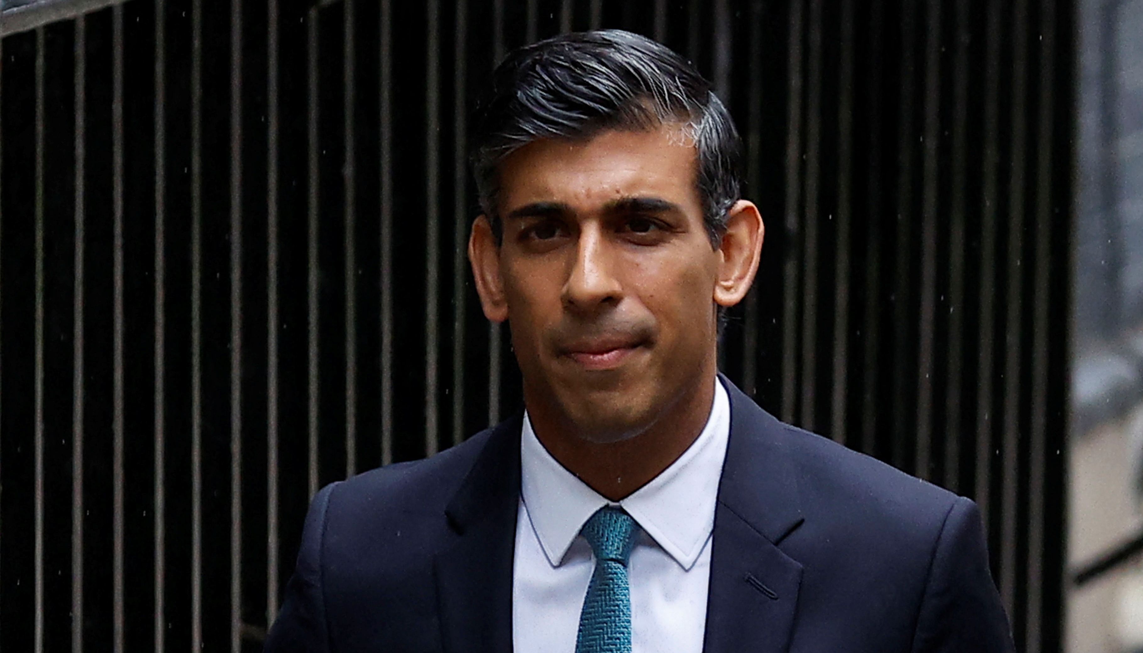 Britain's Prime Minister Rishi Sunak walks outside Number 10 Downing Street in London