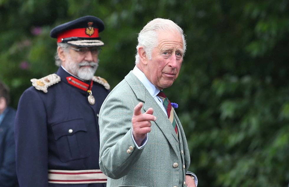 Britain's Prince Charles gestures during a visit to DS McGregor and Partners Veterinary Surgery in Thurso, Caithness