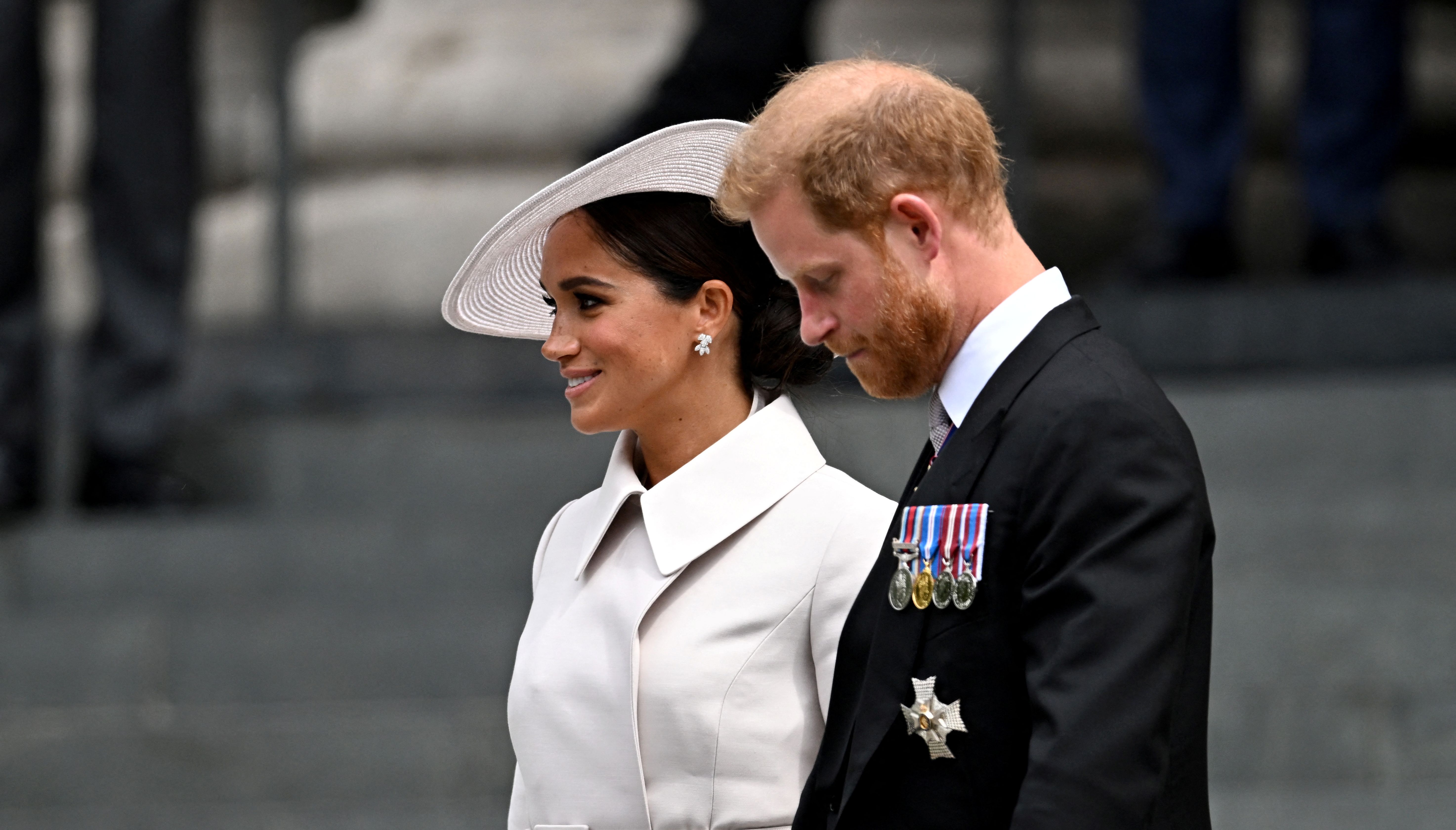Britain's Prince Harry and his wife Meghan, Duchess of Sussex, leave after the National Service of Thanksgiving held at St Paul's Cathedral as part of celebrations marking the Platinum Jubilee of Britain's Queen Elizabeth, in London, Britain, June 3, 2022. REUTERS/Dylan Martinez