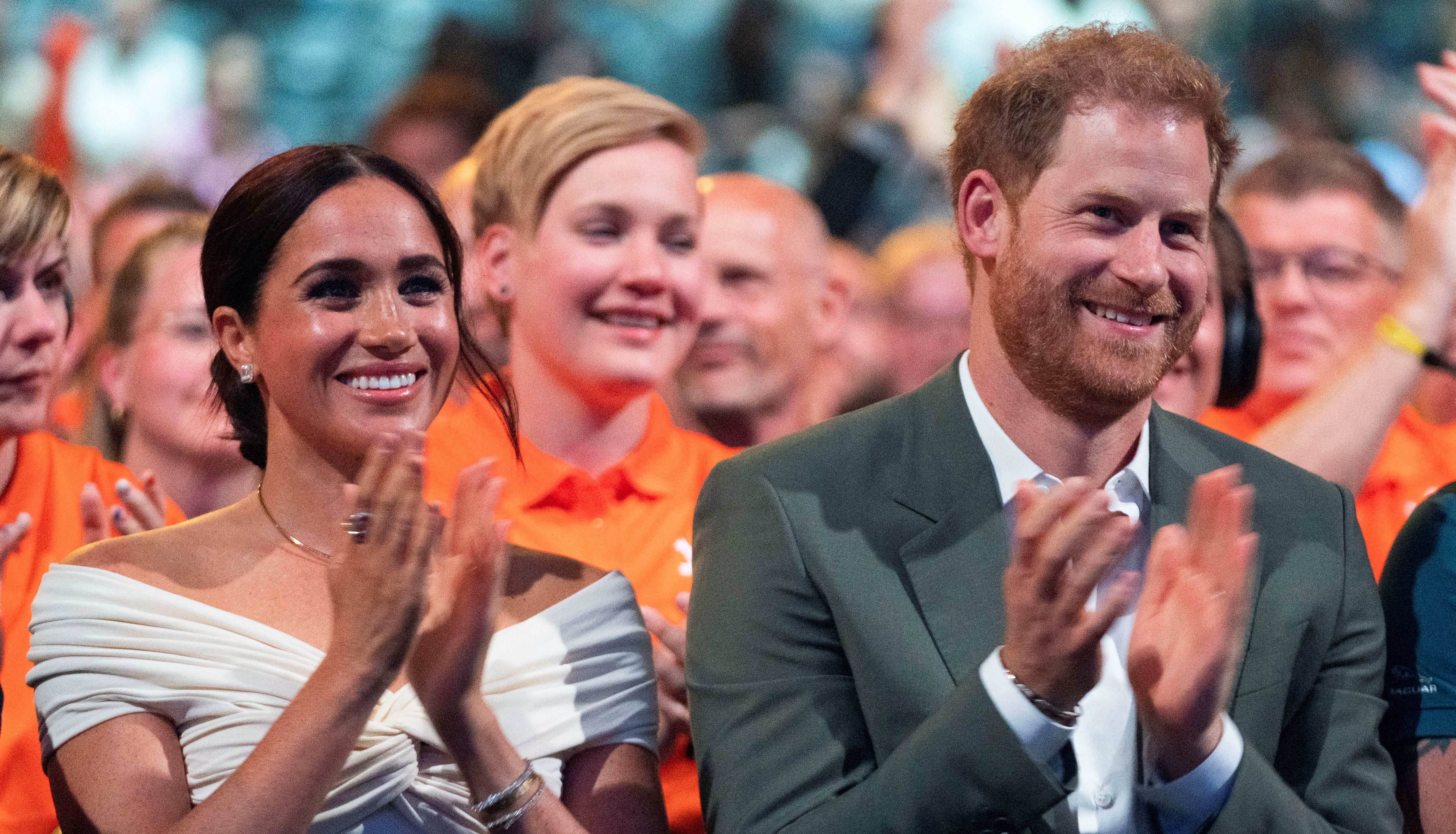 Britain's Prince Harry and Meghan, Duchess of Sussex, attend the opening ceremony of the Invictus Games in The Hague, Netherlands April 16, 2022. Peter Dejong/Pool via REUTERS