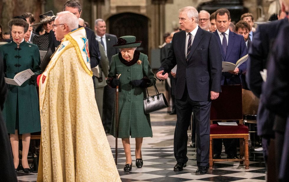 Britain's Queen Elizabeth, accompanied by Prince Andrew, Duke of York, attends a service of thanksgiving for late Prince Philip, Duke of Edinburgh, at Westminster Abbey in London.