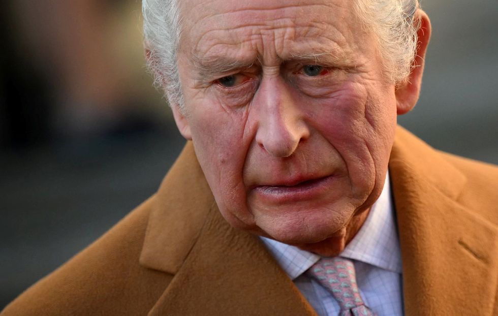 Britain's King Charles reacts as he visits Luton Town Hall in Luton, north of London, Britain December 6, 2022. Daniel Leal/Pool via REUTERS
