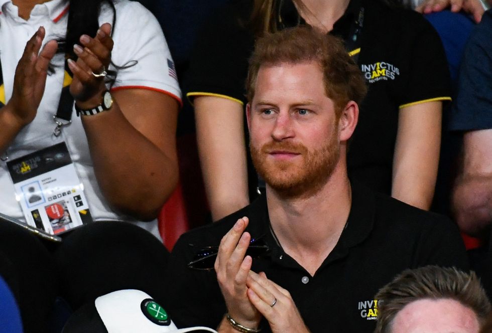 Britain's Prince Harry cheers on competitors as he watches indoor rowing during the Invictus Games in The Hague, Netherlands April 20, 2022. REUTERS/Piroschka Van De Wouw