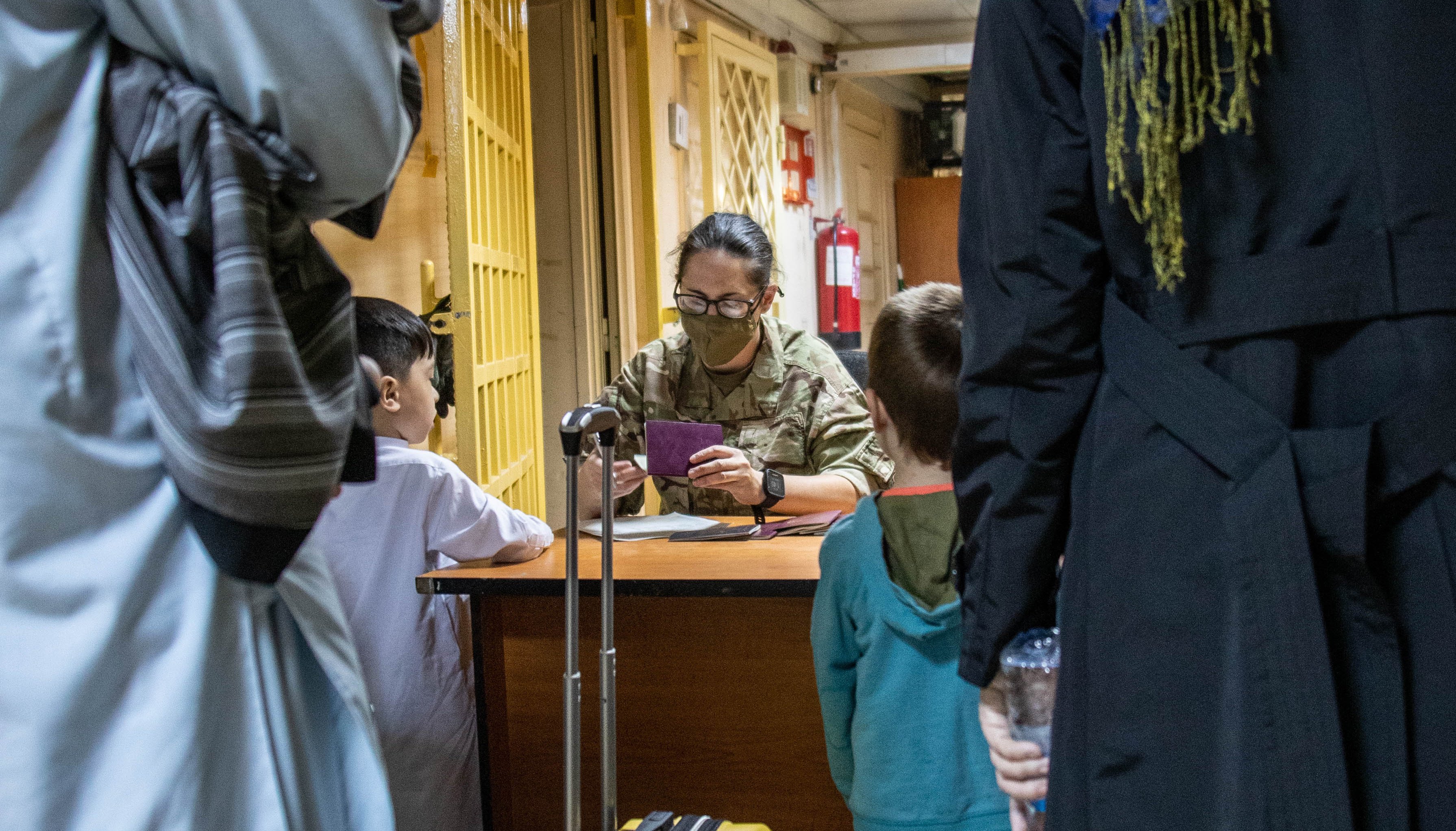 British citizens and dual nationals residing in Afghanistan being processed before being relocated to the UK.