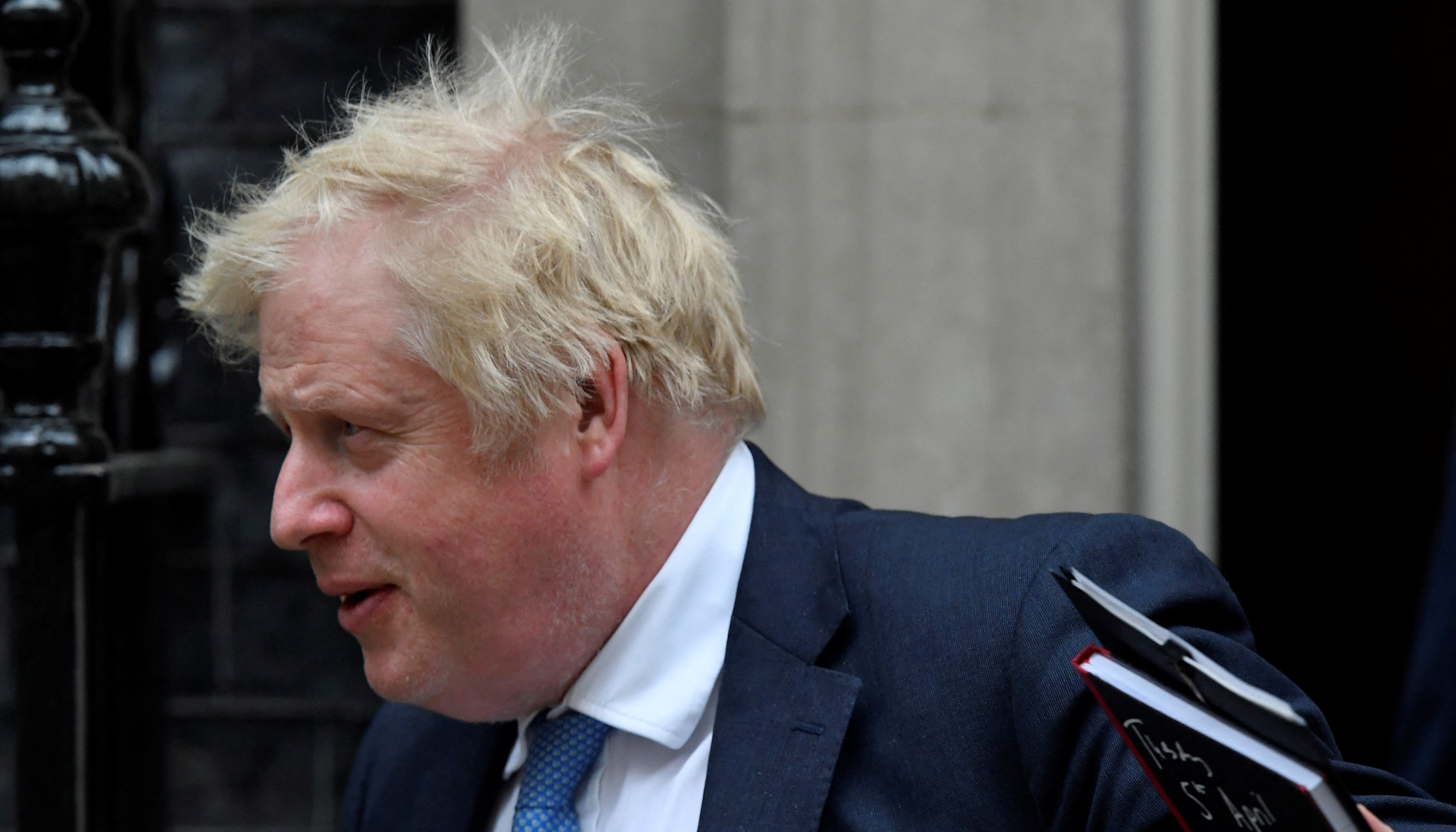 British Prime Minister Boris Johnson departs Downing Street to deliver a statement at the Houses of Parliament.