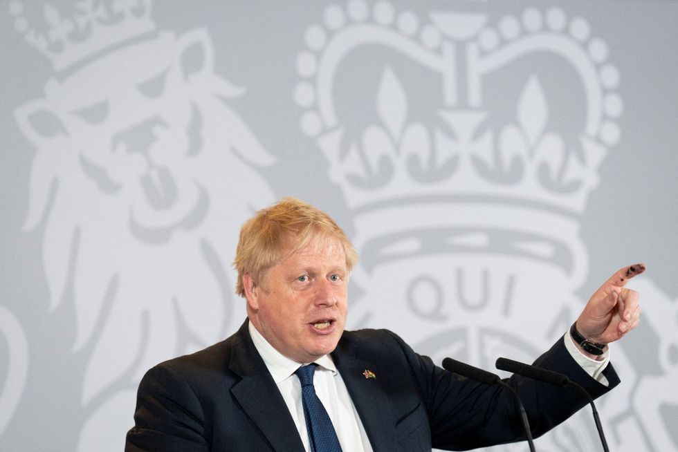 British Prime Minister Boris Johnson gestures as he speaks during a news conference in New Delhi.
