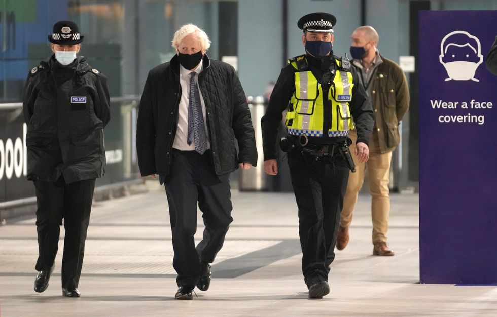 British Prime Minister Boris Johnson talks to British Transport Police officers at Liverpool Lime Street station as part of 'Operation Toxic' to infiltrate County Lines drug dealings, ahead of the publication of the government's 10-year drug strategy. Picture date: Monday December 6, 2021.