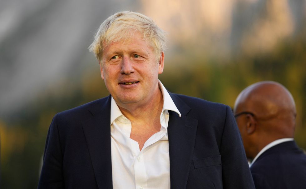 British Prime Minister Boris Johnson waits for the start of a group photo at the G7 summit at Castle Elmau in Kruen, near Garmisch-Partenkirchen, Germany, on Sunday, June 26, 2022. The Group of Seven leading economic powers are meeting in Germany for their annual gathering Sunday through Tuesday. Markus Schreiber/Pool via REUTERS