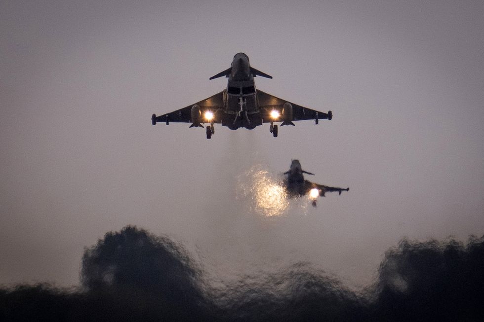 British Royal Air Force Eurofighter Typhoons fighter aircraft fly at RAF Coningsby