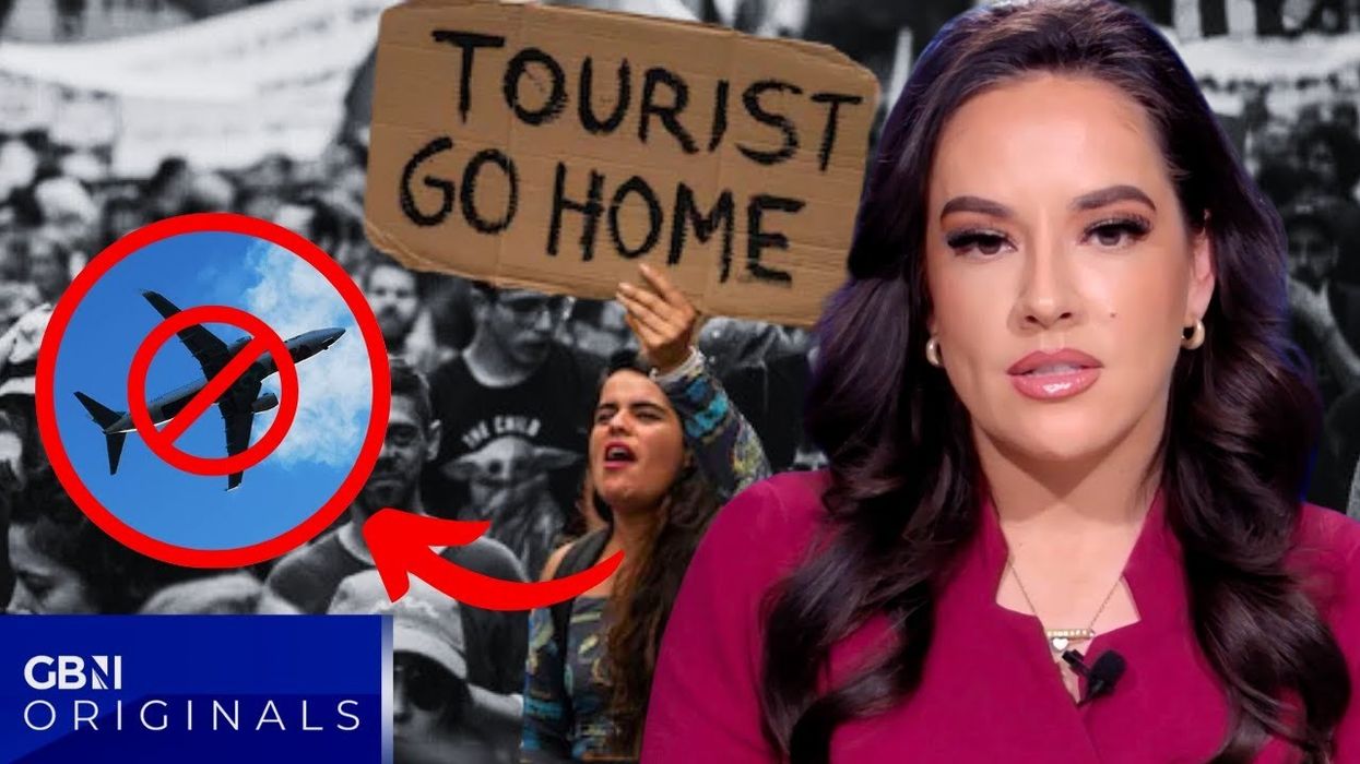 'Tourists go home!' Terrified beach-goers mobbed by hundreds of protesters in Tenerife