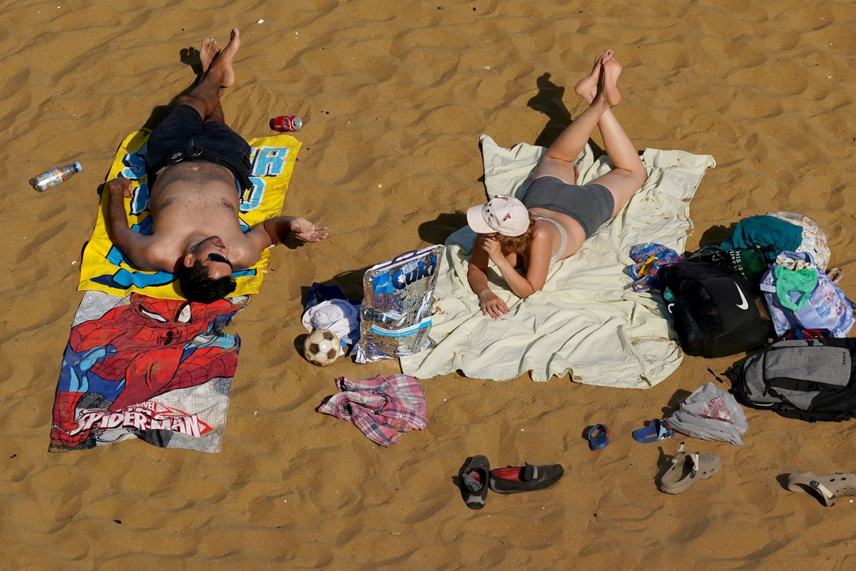 Britons relax on the beach in Broadstairs, Kent, amid a record breaking heatwave