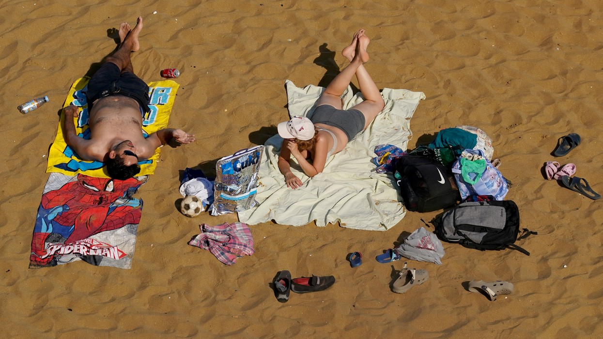 Britons relax on the beach in Broadstairs, Kent, amid a record breaking heatwave