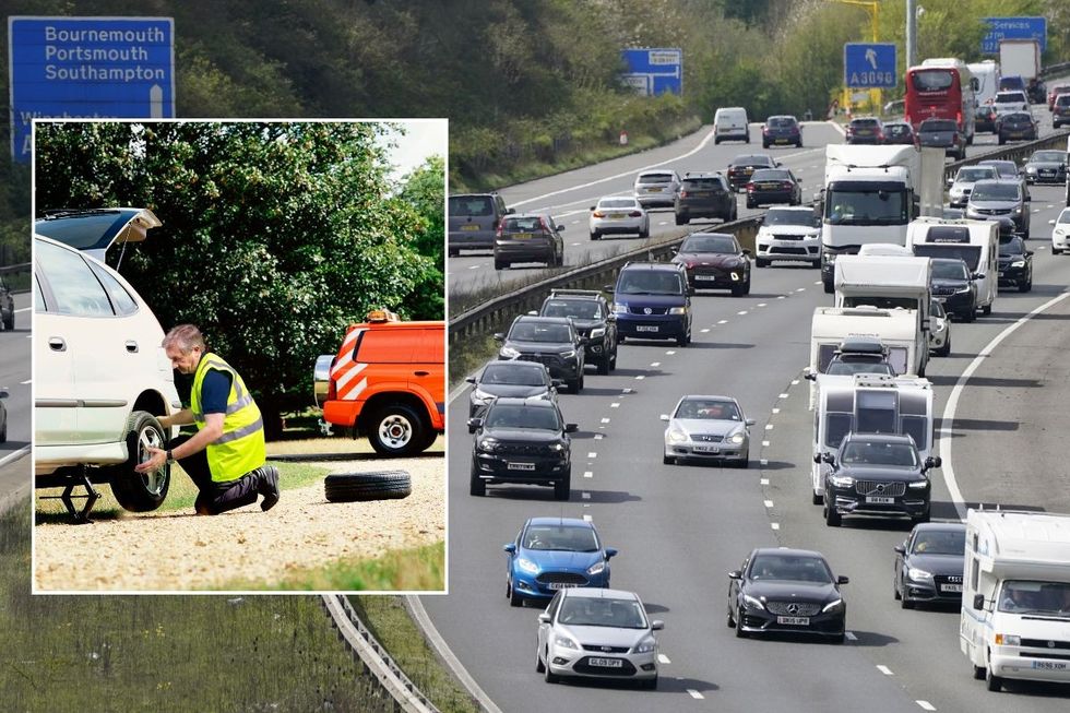 Broken down car and busy traffic