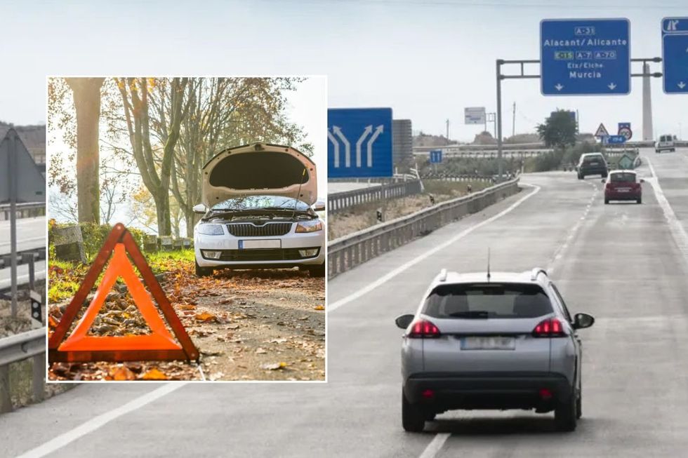 Broken down car and cars driving in Spain