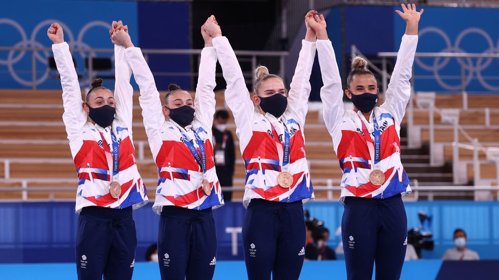 Bronze medalists Jennifer Gadirova of Britain, Jessica Gadirova of Britain, Amelie Morgan of Britain and Alice Kinsella of Britain celebrate on the podium