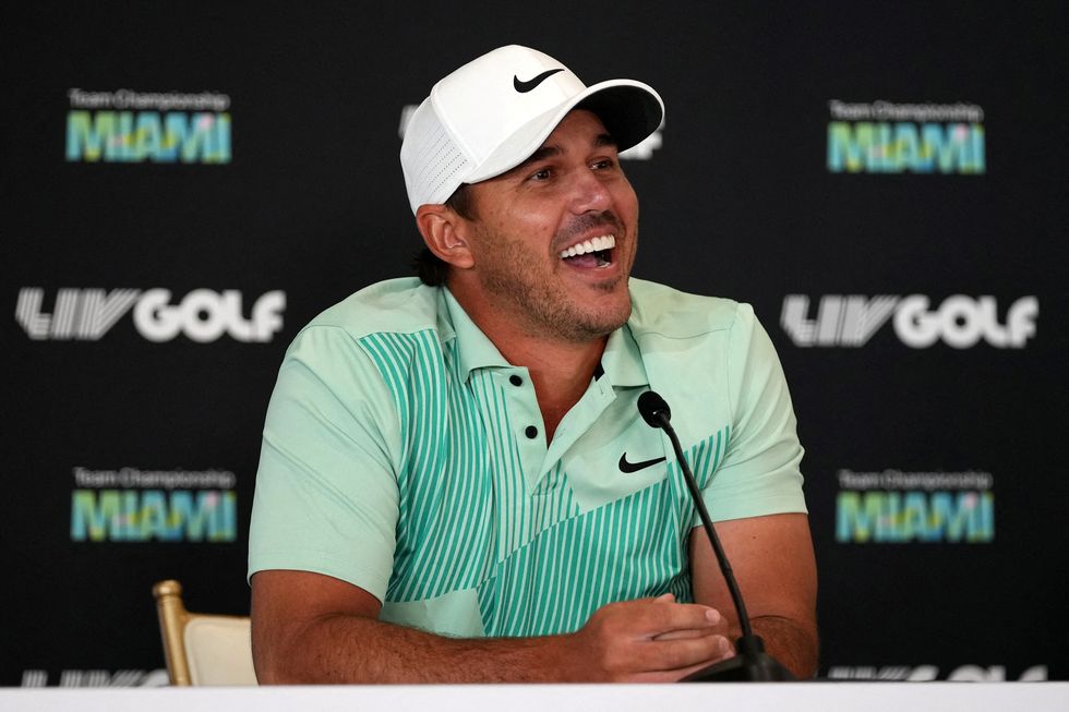 Brooks Koepka reacts during a press conference before the LIV Golf series at Trump National Doral