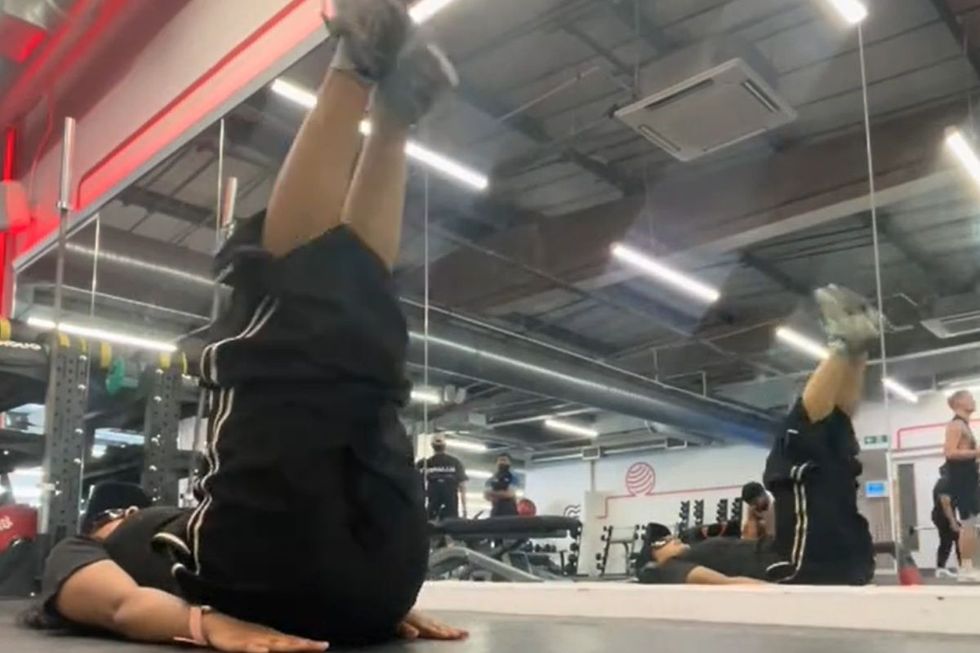 BROWNSIGMAMALE performing leg raises