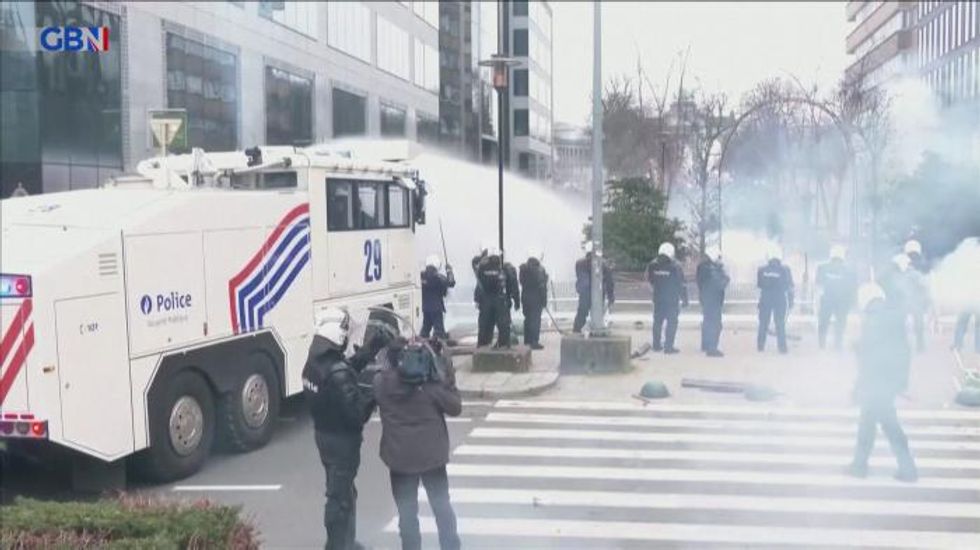 Water cannon and tear gas used at Covid protests against Covid vaccine passports in Brussels