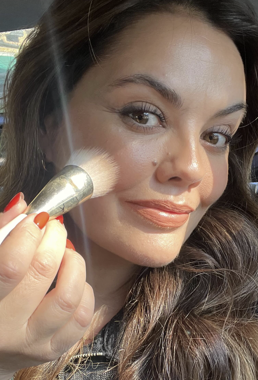 Bryony Blake applying makeup