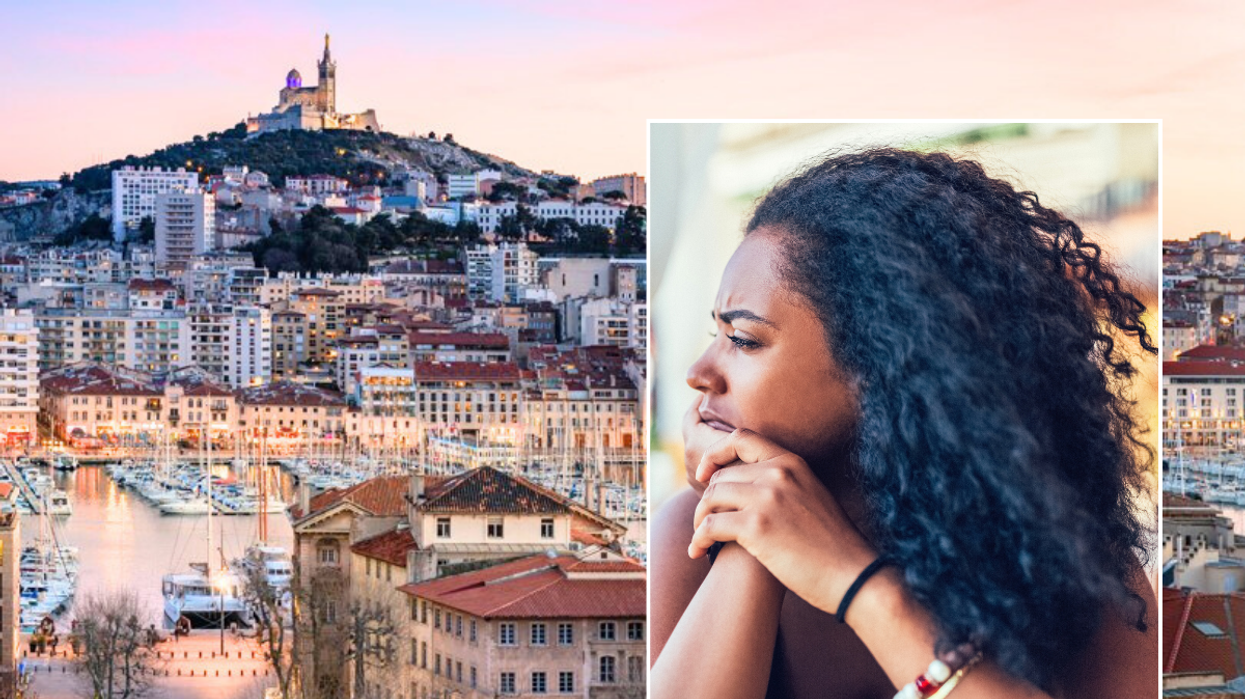 Buildings in Marseille / woman looking stressed