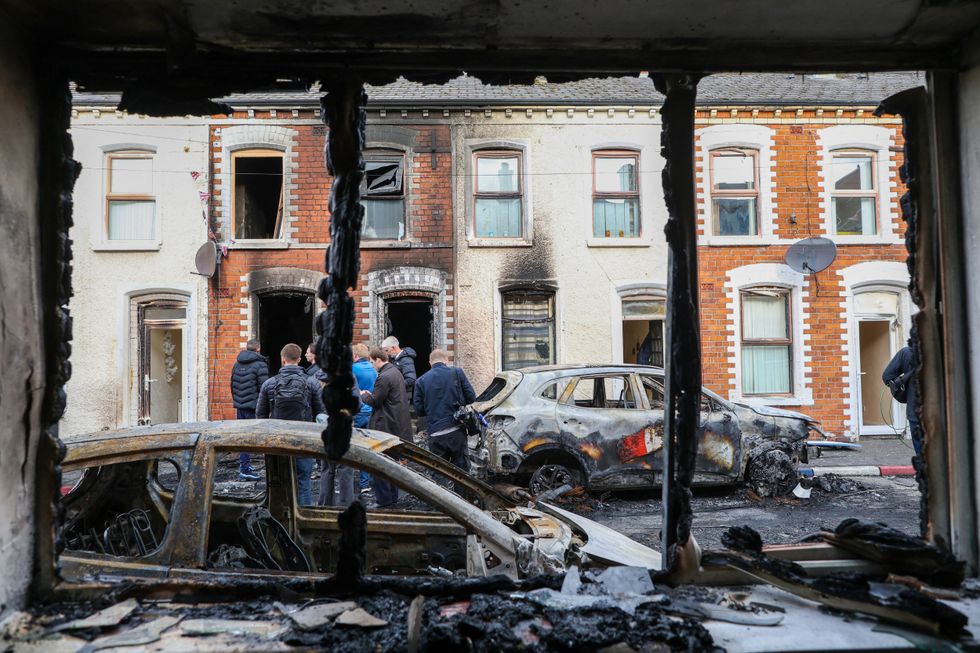 Burnt-out cars and houses in Belfast on Tuesday