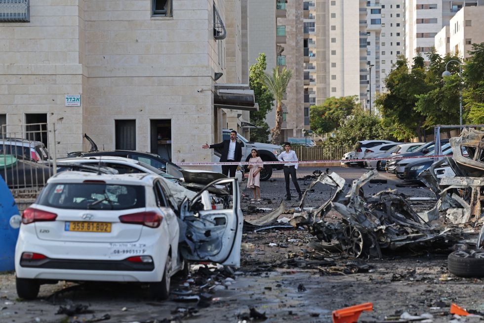 Burnt-out vehicles in Ashkelon following a rocket attack from the Gaza Strip into Israel on October 7, 2023\u200b