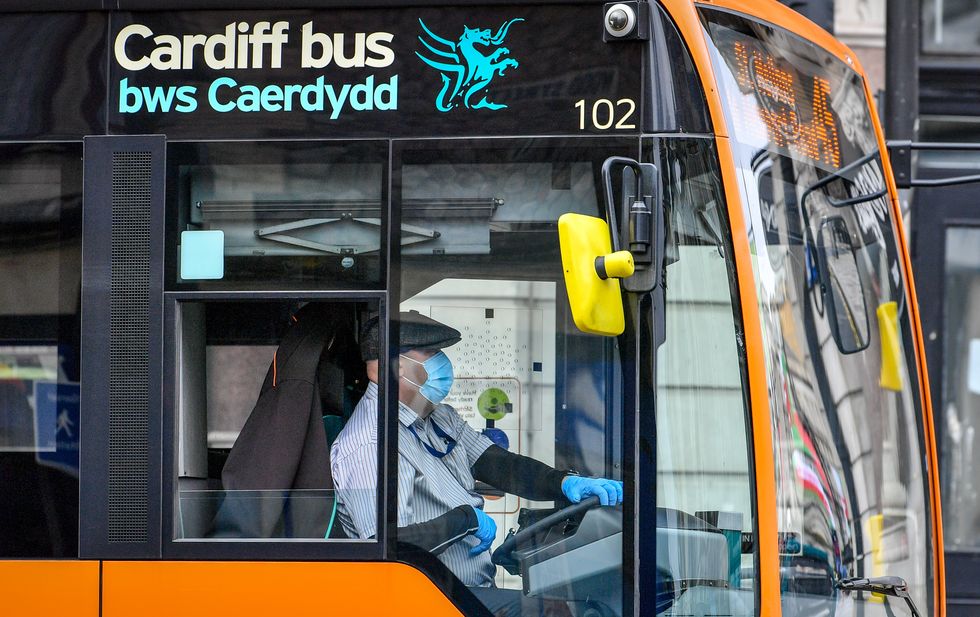 Bus driver wears a mask and gloves in Cardiff as face coverings become mandatory on public transport in Wales to help prevent the spread of coronavirus.