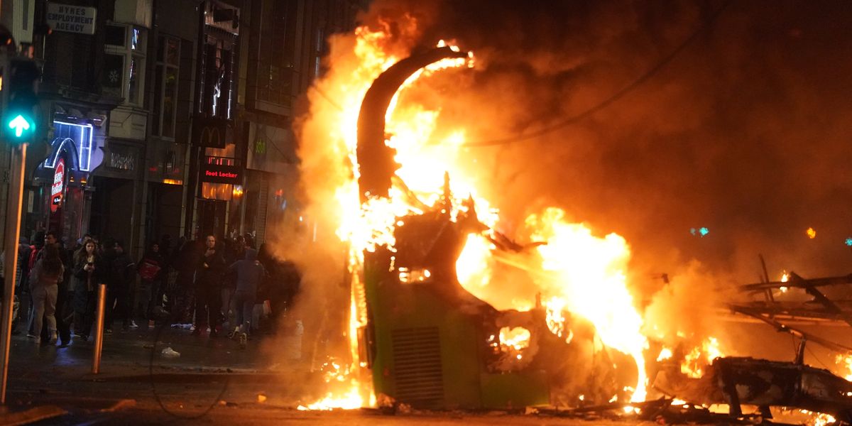 NextImg:Violent clashes with police in Dublin after five injured in knife attack - buses set alight and shops looted