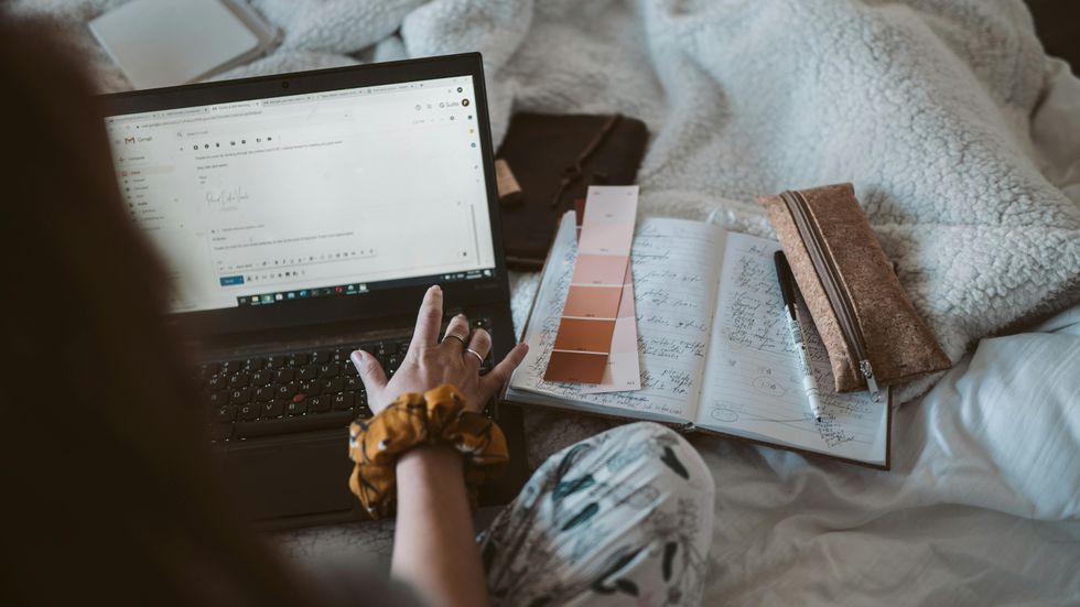 Business owner writes email using Gmail