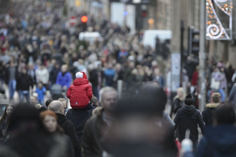 Busy high street with people walking along it