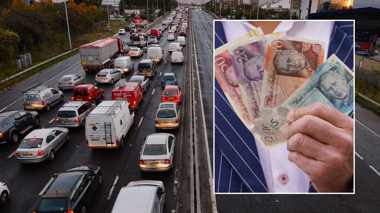 Busy London road and a man holding cash
