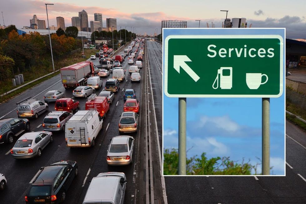 Busy motorway and a motorway service station sign