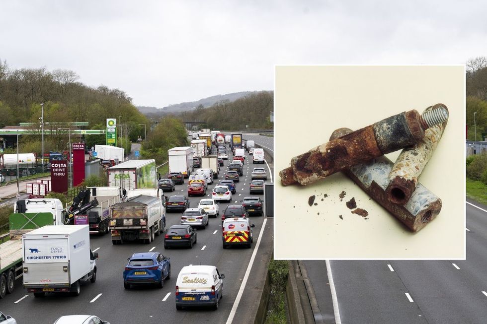 Busy motorway and a rusted, aged anchor